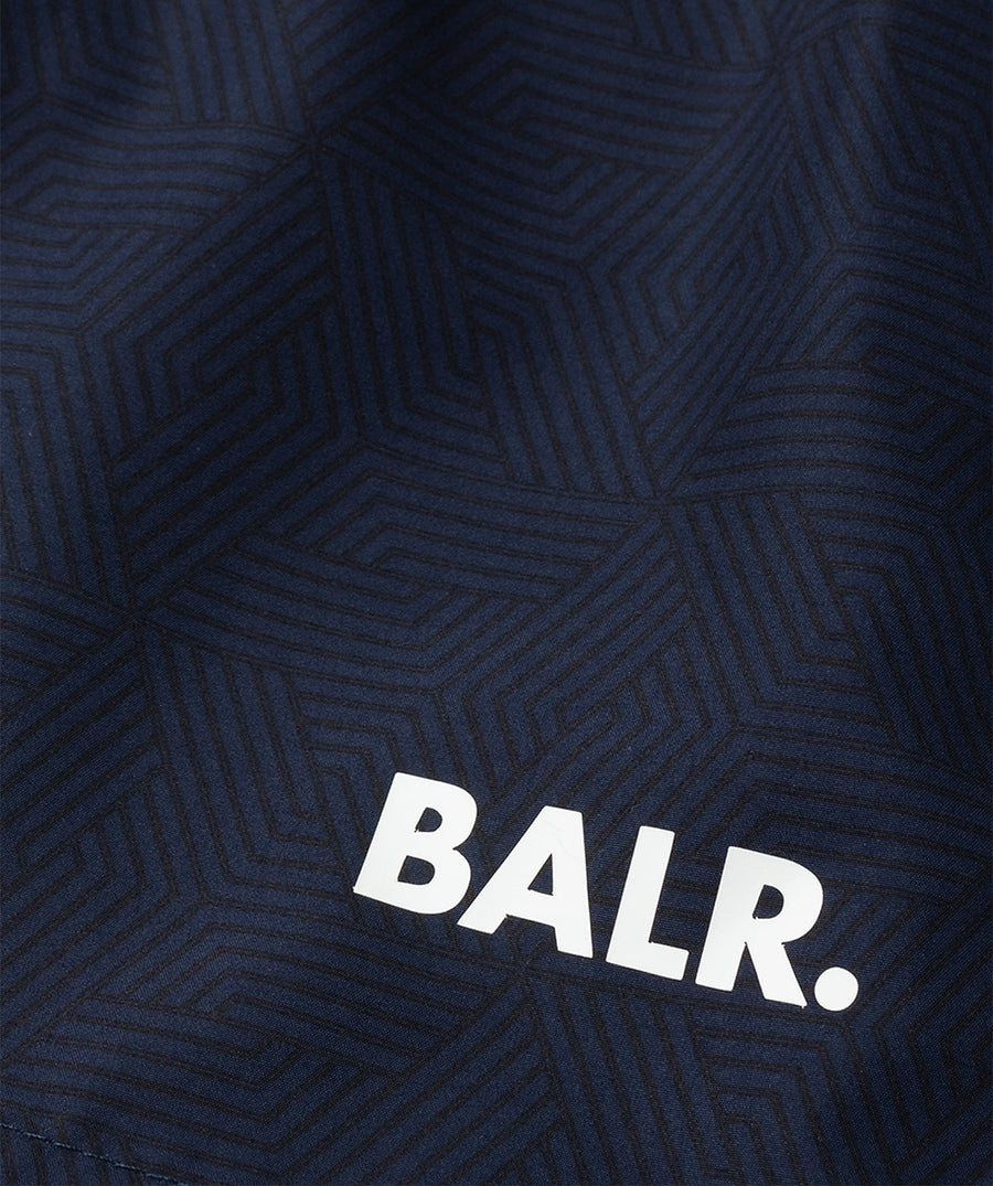 BALR Monogram Swim Shorts B1451.1034 – premium swim shorts featuring an all-over BALR monogram print, an elasticated waistband with a drawcord, and two zippered pockets. Made from lightweight, quick-drying fabric for ultimate comfort and style by the water.