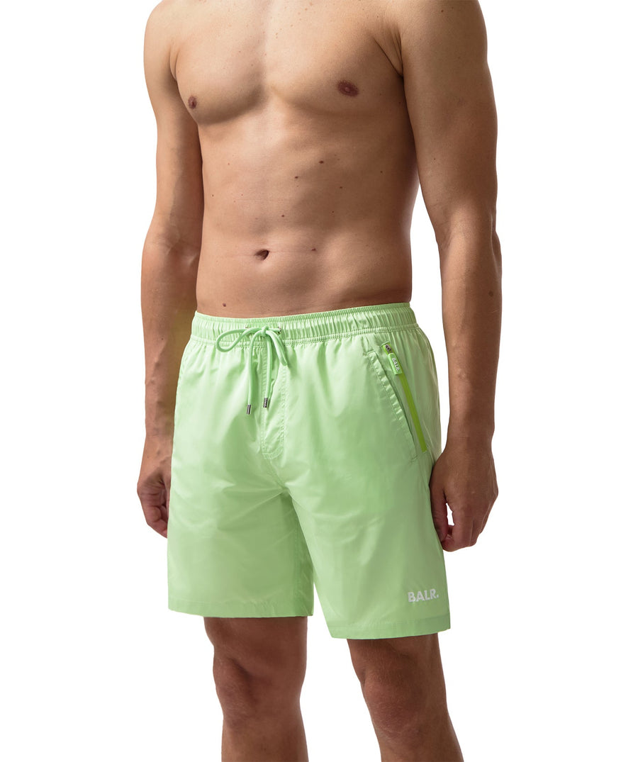 BALR Logo Swim Shorts B1451.1035 – premium swim shorts featuring an elasticated waistband with a drawcord, bold BALR branding, and two zippered pockets. Designed for comfort and style, these shorts are perfect for beach days or poolside relaxation.