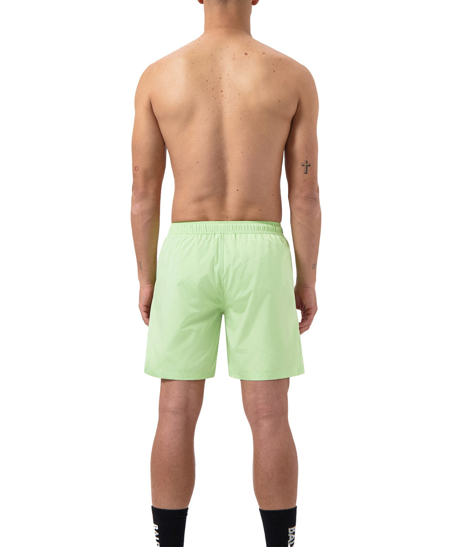 BALR Logo Swim Shorts B1451.1035 – premium swim shorts featuring an elasticated waistband with a drawcord, bold BALR branding, and two zippered pockets. Designed for comfort and style, these shorts are perfect for beach days or poolside relaxation.