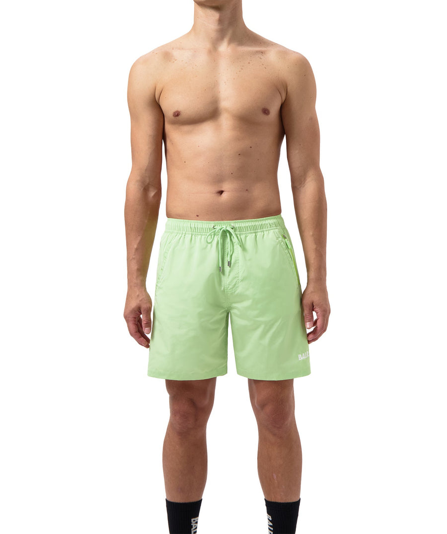 BALR Logo Swim Shorts B1451.1035 – premium swim shorts featuring an elasticated waistband with a drawcord, bold BALR branding, and two zippered pockets. Designed for comfort and style, these shorts are perfect for beach days or poolside relaxation.