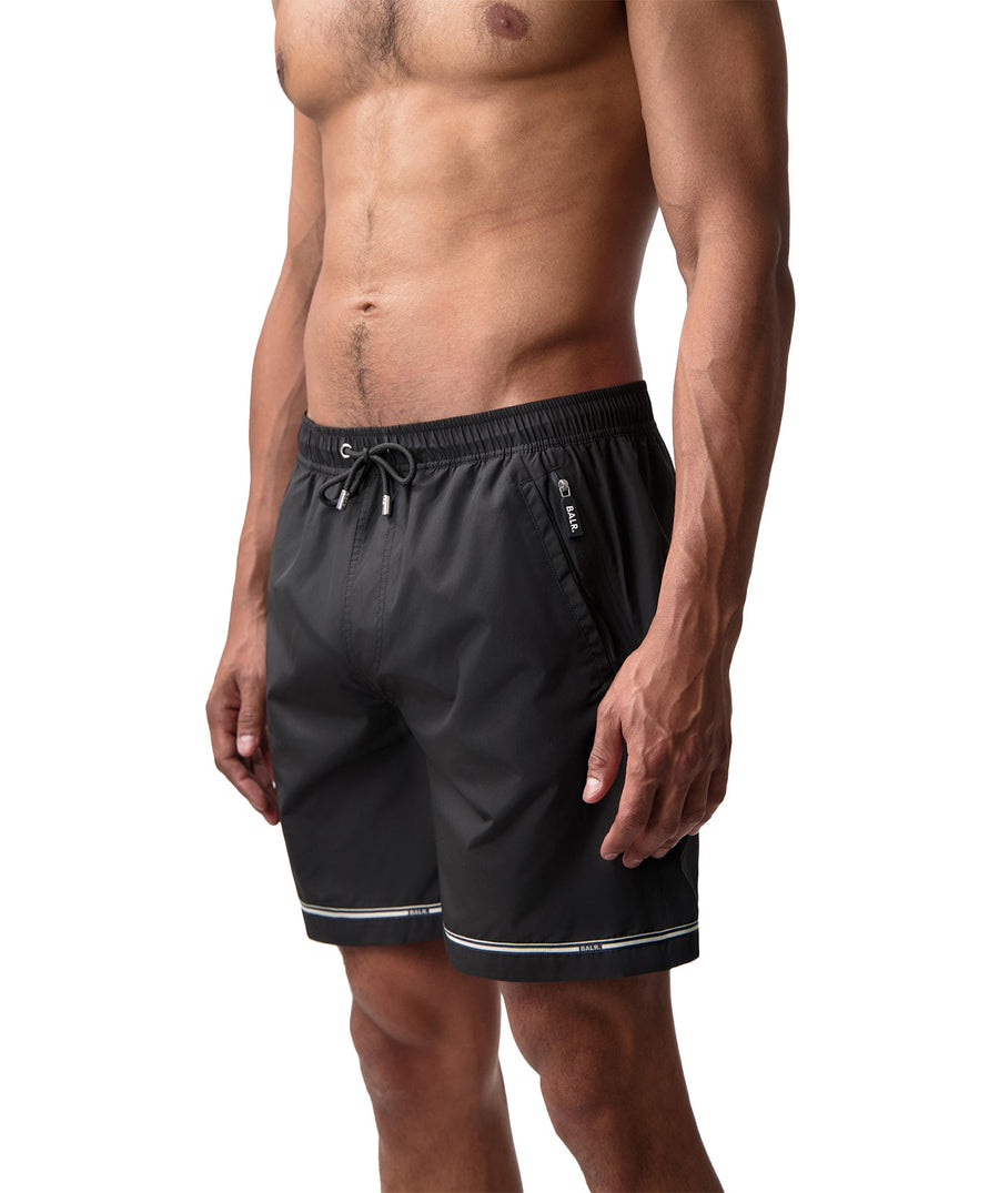 BALR Tape Swim Shorts B1451.1036 – stylish swim shorts featuring an elasticated waistband with a drawcord, BALR-branded side tape detailing, and two zippered pockets. Made from lightweight, quick-drying fabric, perfect for beach days and poolside lounging.