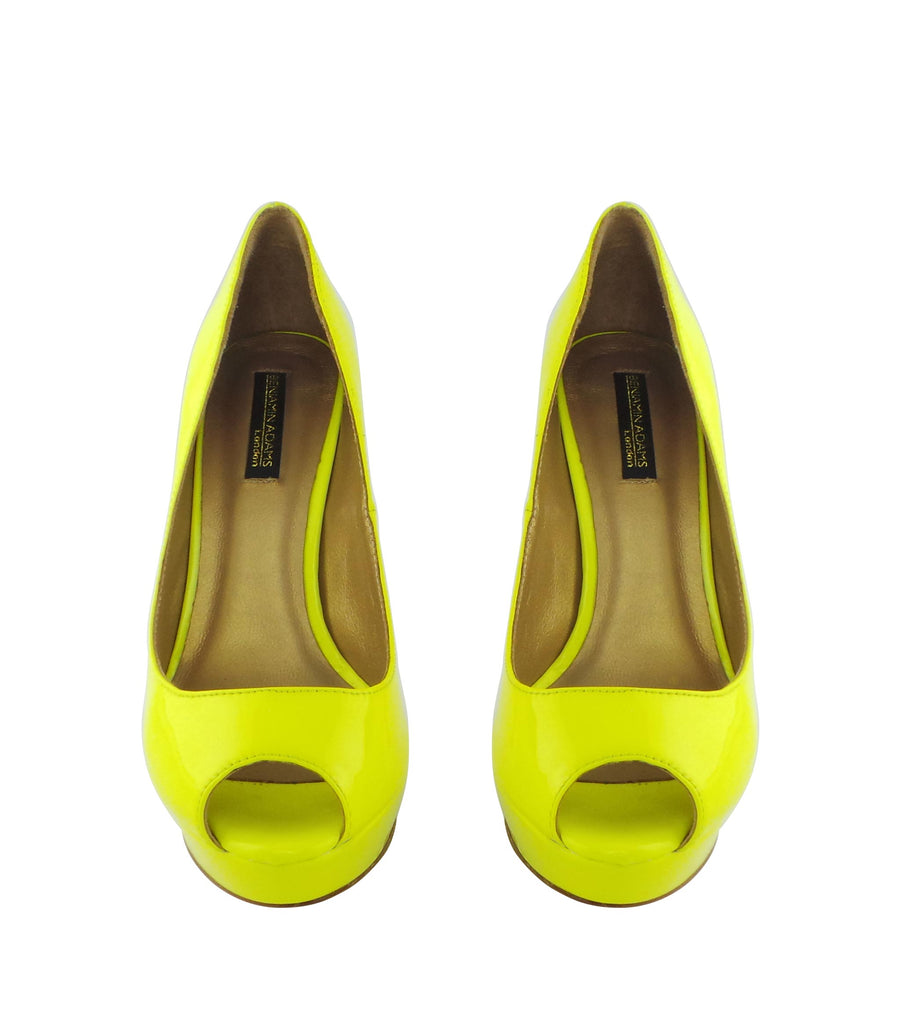 Benjamin Adams Anaheim lemon yellow patent leather peep toe pumps. Featuring a sleek design, 5-inch heel, and glossy finish. Perfect for any occasion