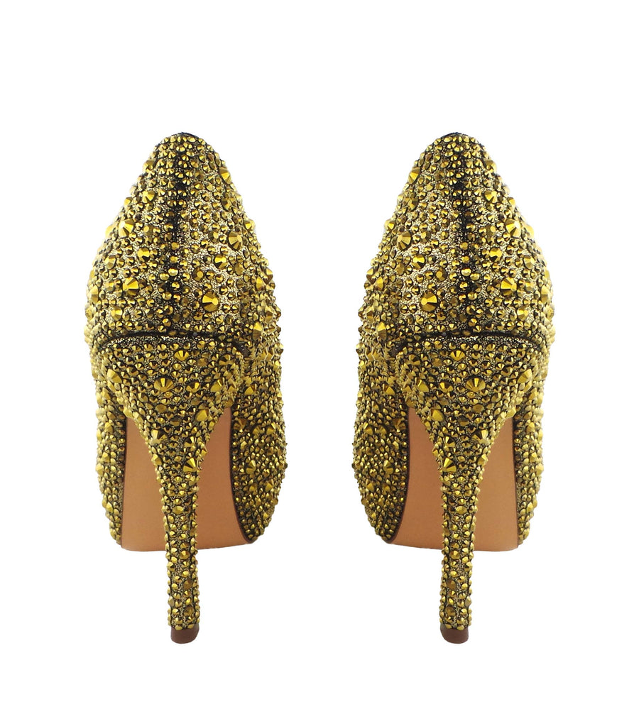 Step into luxury with the Benjamin Adams Rio Jewel Platforms in gold. Perfect for glam events &amp; special occasions