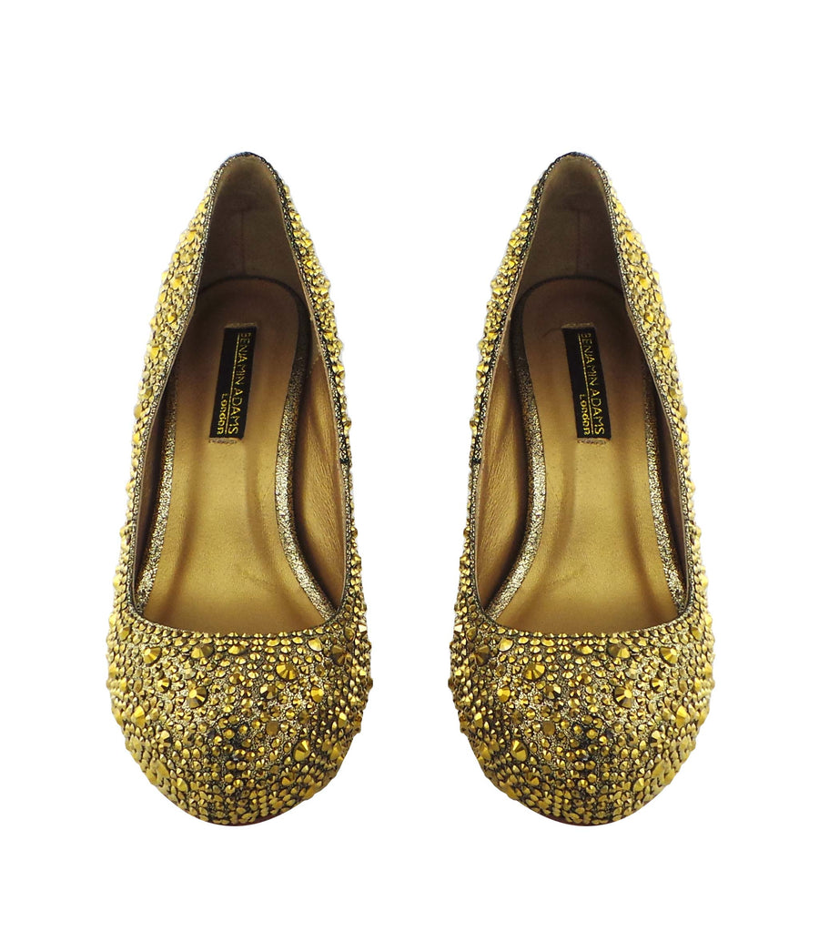 Step into luxury with the Benjamin Adams Rio Jewel Platforms in gold. Perfect for glam events &amp; special occasions