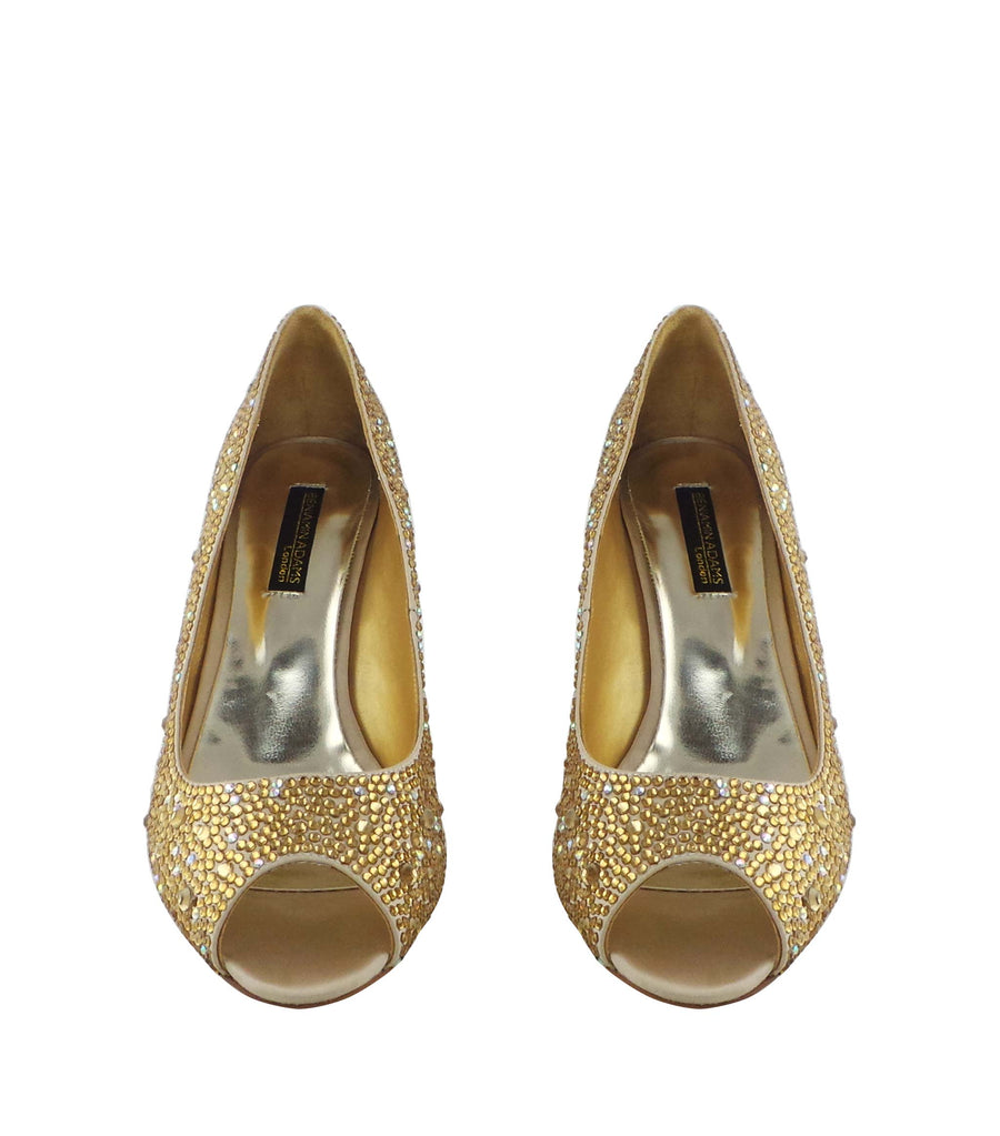 Champagne Benjamin Adams Oslo evening shoes are a toned down version of the vampy platform styles. The Oslo is a gorgeous peep toe pump with crystals encrusted all over. The moderate 3 1/4" heel gives you a bit of height while still preserving comfort.