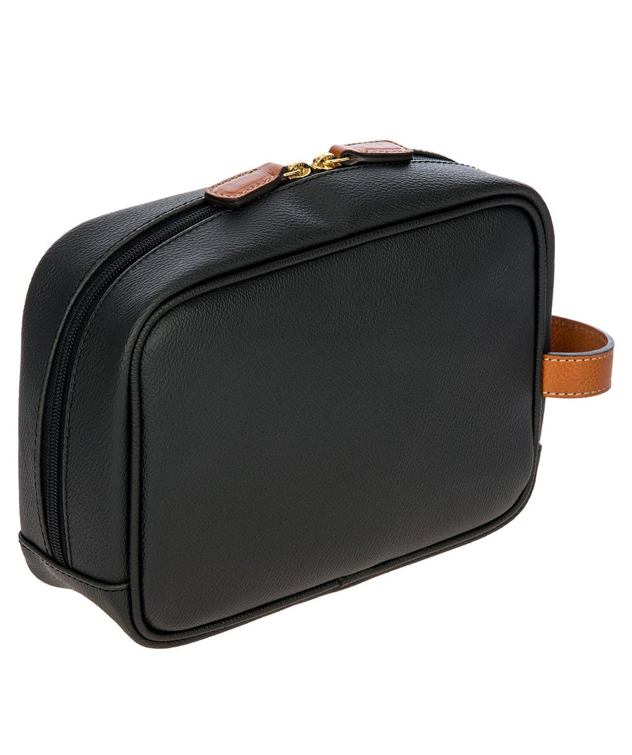 Bric's black leather toiletry bag with brown leather accents, gold-tone double zipper closure, side handle, and 'Made in Italy' logo patch, style code BBJ00601.001.