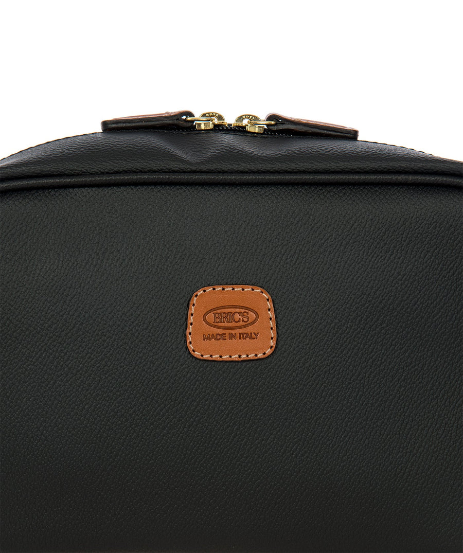 Bric's black leather toiletry bag with brown leather accents, gold-tone double zipper closure, side handle, and 'Made in Italy' logo patch, style code BBJ00601.001.