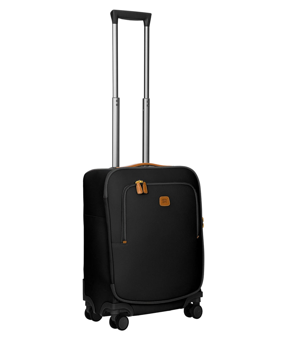 Bric's black 32" Firenze carry-on spinner suitcase with brown leather accents, front zip pocket, gold-tone zippers, telescopic handle, and 360° spinner wheels, style code BBJ15290.001