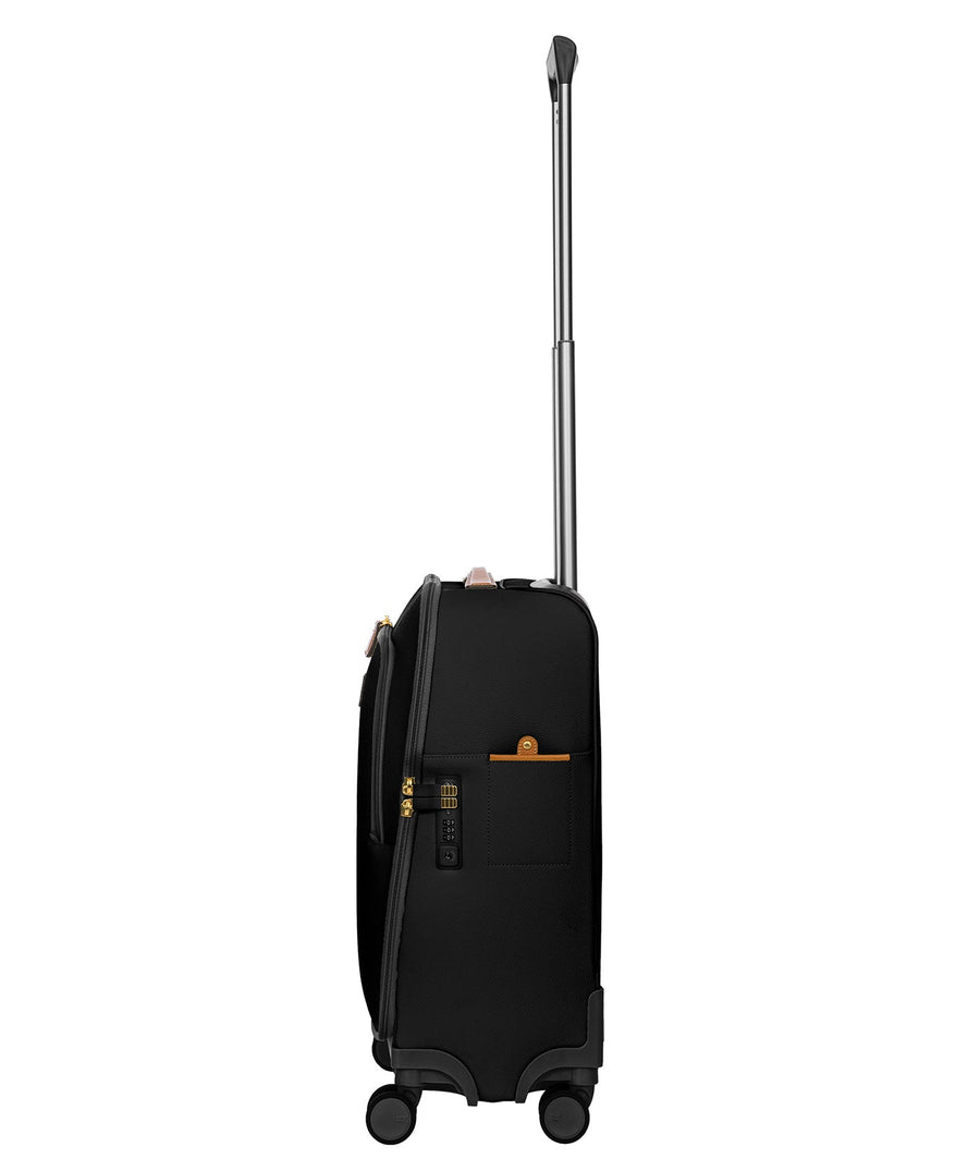 Bric's black 32" Firenze carry-on spinner suitcase with brown leather accents, front zip pocket, gold-tone zippers, telescopic handle, and 360° spinner wheels, style code BBJ15290.001