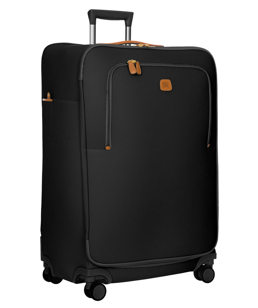 Bric's black 32" Firenze Trolley checked spinner suitcase with brown leather accents, front zip pocket, gold-tone zippers, telescopic handle, and 360° spinner wheels, style code BBJ15291.