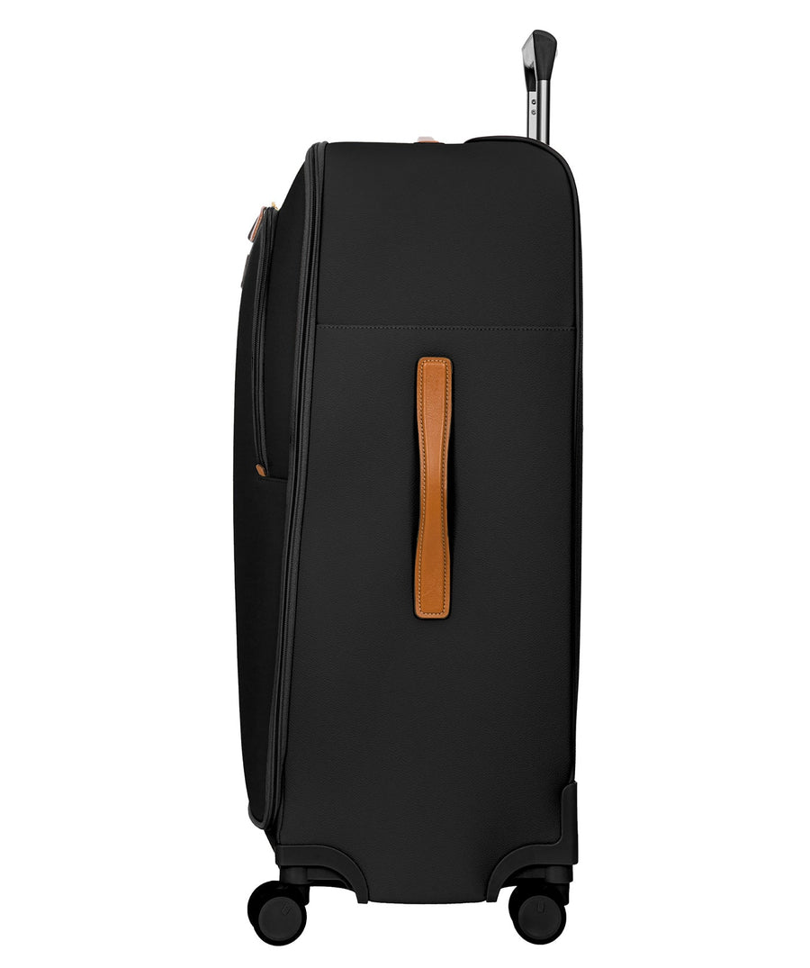 Bric's black 32" Firenze Trolley checked spinner suitcase with brown leather accents, front zip pocket, gold-tone zippers, telescopic handle, and 360° spinner wheels, style code BBJ15291.