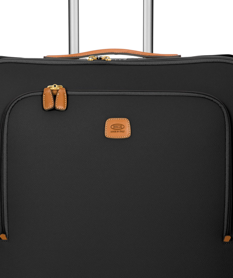 Bric's black 32" Firenze Trolley checked spinner suitcase with brown leather accents, front zip pocket, gold-tone zippers, telescopic handle, and 360° spinner wheels, style code BBJ15291.