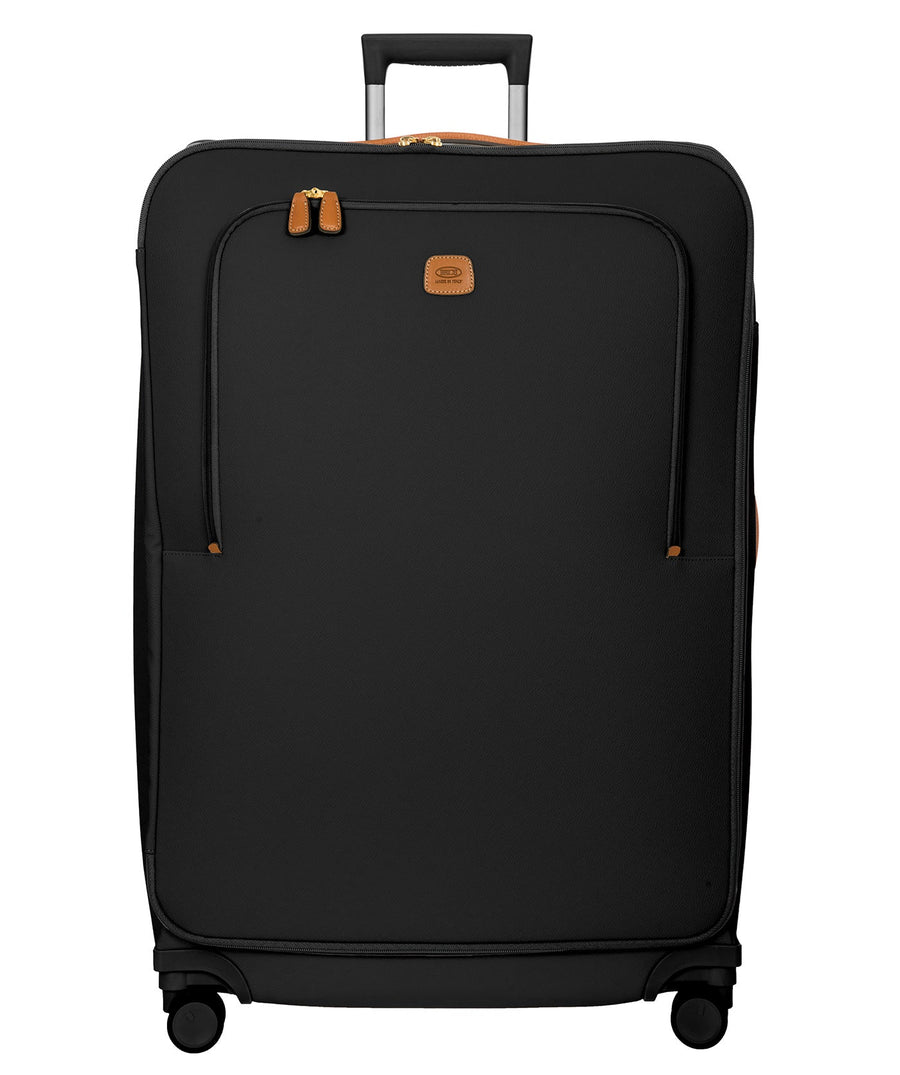 Bric's 32" Firenze Trolley checked spinner suitcase featuring black fabric, brown leather accents, front zip pocket, gold-tone zippers, telescopic handle, 360° spinner wheels, and style code BBJ15292.