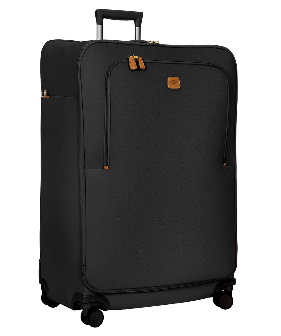 Bric's 32" Firenze Trolley checked spinner suitcase featuring black fabric, brown leather accents, front zip pocket, gold-tone zippers, telescopic handle, 360° spinner wheels, and style code BBJ15292.