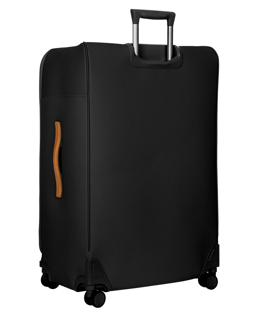 Bric's 32" Firenze Trolley checked spinner suitcase featuring black fabric, brown leather accents, front zip pocket, gold-tone zippers, telescopic handle, 360° spinner wheels, and style code BBJ15292.