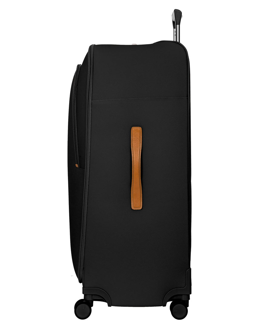 Bric's 32" Firenze Trolley checked spinner suitcase featuring black fabric, brown leather accents, front zip pocket, gold-tone zippers, telescopic handle, 360° spinner wheels, and style code BBJ15292.