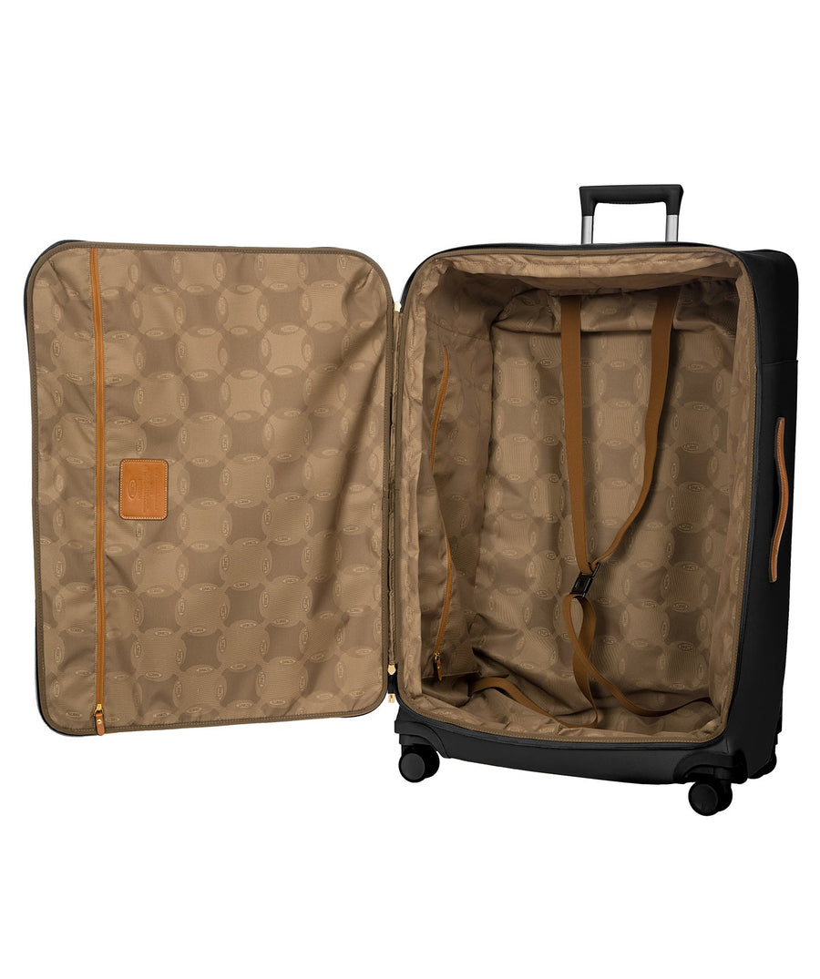 Bric's 32" Firenze Trolley checked spinner suitcase featuring black fabric, brown leather accents, front zip pocket, gold-tone zippers, telescopic handle, 360° spinner wheels, and style code BBJ15292.