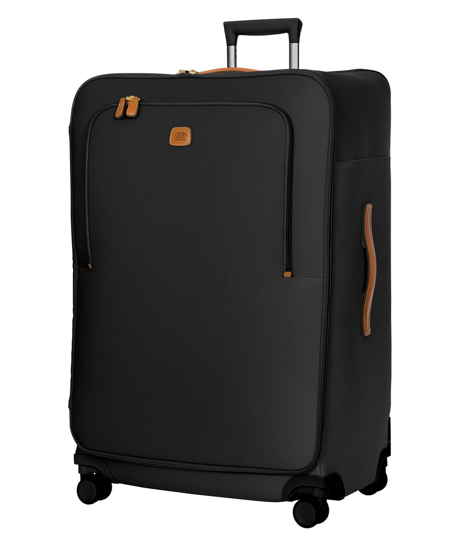 Bric's 32" Firenze Trolley checked spinner suitcase featuring black fabric, brown leather accents, front zip pocket, gold-tone zippers, telescopic handle, 360° spinner wheels, and style code BBJ15292.