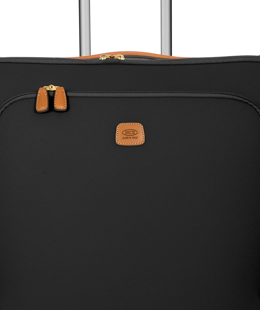 Bric's 32" Firenze Trolley checked spinner suitcase featuring black fabric, brown leather accents, front zip pocket, gold-tone zippers, telescopic handle, 360° spinner wheels, and style code BBJ15292.