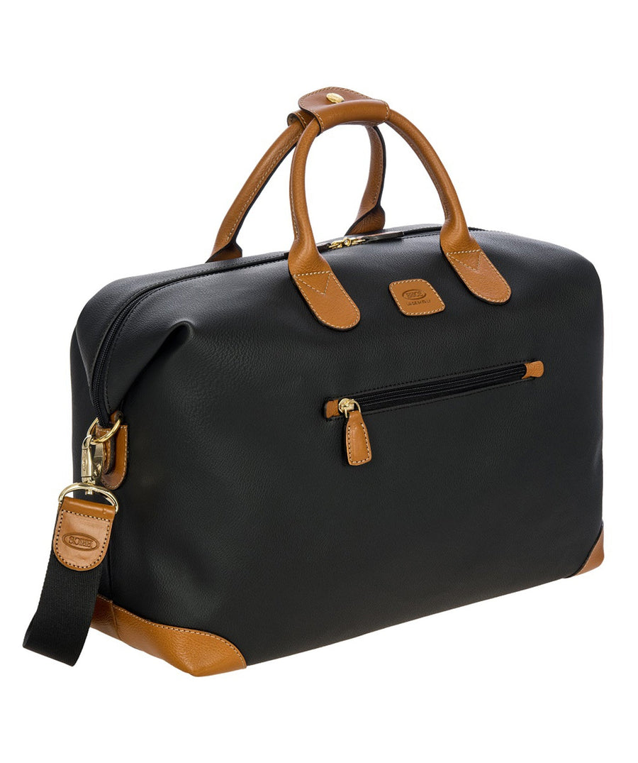 Bric's 18" Firenze Cargo Duffle Bag in black with brown leather accents, featuring double top handles, a front zip pocket, gold-tone zippers, and a spacious interior with logo-printed lining and an inner zip pocket. Style code BBJ20203.