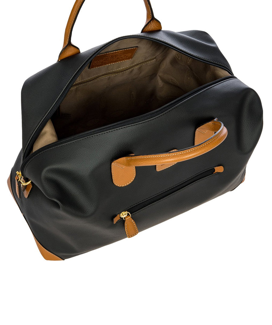 Bric's 18" Firenze Cargo Duffle Bag in black with brown leather accents, featuring double top handles, a front zip pocket, gold-tone zippers, and a spacious interior with logo-printed lining and an inner zip pocket. Style code BBJ20203.